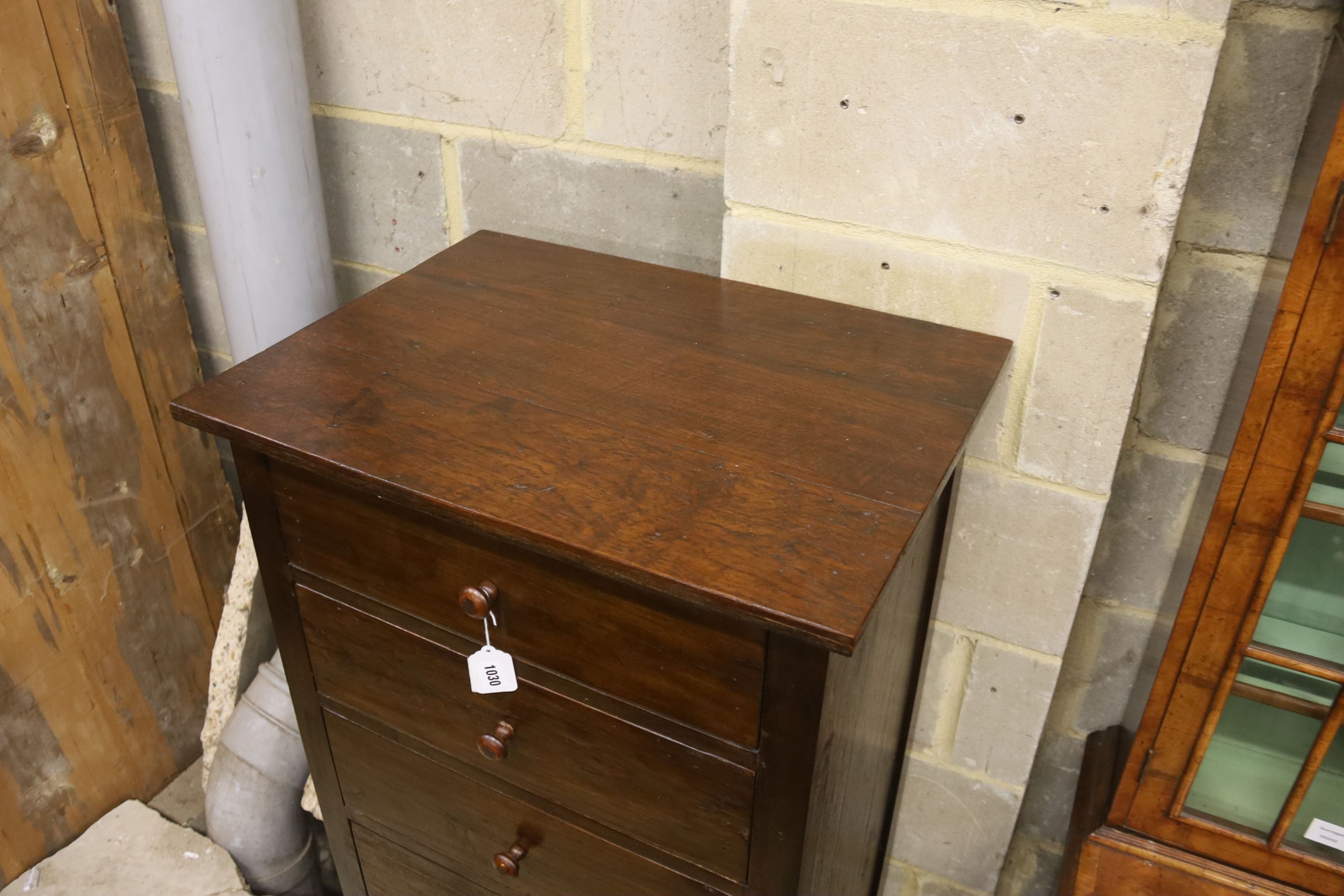 A modern hardwood seven drawer tall chest, width 63cm, depth 48cm, height 152cm